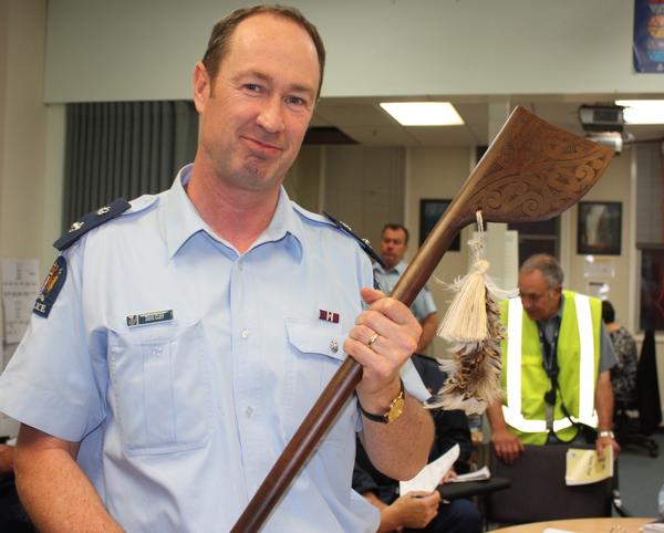 Superintendent Dave Cliff with a tewhatewha, gifted by Bay of Plenty colleagues. 